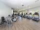 A community gym featuring modern exercise equipment, fans and flooring at 1531 Belfry Dr, Venice, FL 34292