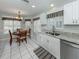 Kitchen area boasts granite counters, stainless steel appliances, and a bright breakfast nook at 1531 Belfry Dr, Venice, FL 34292