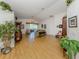 Open living room with wood floors, high ceilings, sliders to outdoors, and tasteful decor at 1531 Belfry Dr, Venice, FL 34292