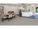 A community lounge area with a kitchenette, piano and dining area at 1531 Belfry Dr, Venice, FL 34292