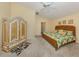 Spacious bedroom with neutral walls, ceiling fan, and decorative accents at 1531 Belfry Dr, Venice, FL 34292