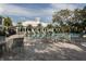 Community pool deck featuring lounge chairs and well-maintained landscaping at 1531 Belfry Dr, Venice, FL 34292