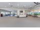 Spacious recreation room with ample seating, a television, and access to outdoor views at 1531 Belfry Dr, Venice, FL 34292