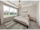 Relaxing bedroom with a large window, neutral colors, and stylish decor at 15364 Isla Palma Ln, Nokomis, FL 34275
