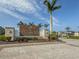 Beautiful community entrance sign with landscaping and brick paved road in Palmero Sarasota at 15364 Isla Palma Ln, Nokomis, FL 34275
