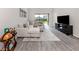 Spacious living room with tile floors and large sectional sofa at 15364 Isla Palma Ln, Nokomis, FL 34275