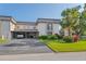 Exterior of the property featuring mature landscaping, driveway and carport at 1728 S Lakeside Dr # 1720B, Venice, FL 34293