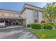 Exterior of the property featuring mature landscaping, driveway and carport at 1728 S Lakeside Dr # 1720B, Venice, FL 34293