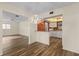 Open concept view of kitchen with white cabinets, a breakfast bar, and updated appliances at 1728 S Lakeside Dr # 1720B, Venice, FL 34293