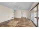 Spacious living room featuring modern floors, neutral walls and a sliding glass door leading to a lanai at 1728 S Lakeside Dr # 1720B, Venice, FL 34293