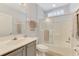 Bright bathroom featuring a walk-in shower, toilet, and sink at 1799 Fountain View Cir, Venice, FL 34292