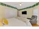 Spacious bedroom with hardwood flooring, bright natural light, and comfortable furniture at 1799 Fountain View Cir, Venice, FL 34292