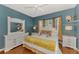 Bright bedroom features a white bed frame, bay window, and stylish decorations at 1799 Fountain View Cir, Venice, FL 34292