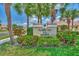 Entrance to Fountain View Villas features lush landscaping and prominent signage at 1799 Fountain View Cir, Venice, FL 34292