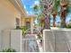 Charming gated entrance with brick pavers, leading to the front door at 1799 Fountain View Cir, Venice, FL 34292
