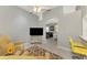 Open living space with comfortable seating and open archway to the dining area at 1799 Fountain View Cir, Venice, FL 34292