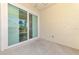 Outdoor patio featuring views of tropical landscaping and palm trees at 1799 Fountain View Cir, Venice, FL 34292