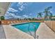 Community pool offering a refreshing escape, complete with comfortable lounge chairs and sunny skies at 1799 Fountain View Cir, Venice, FL 34292