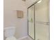 Shower with glass doors and towel rack at 1799 Fountain View Cir, Venice, FL 34292