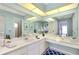 Bright bathroom featuring double vanity, and large mirror reflecting the spacious interior at 18375 Lamont Ave, Port Charlotte, FL 33948