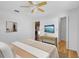 Cozy bedroom featuring a ceiling fan, natural light, and open doorway at 18375 Lamont Ave, Port Charlotte, FL 33948