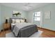 Comfortable bedroom featuring a ceiling fan, natural light and decorative wall art at 18375 Lamont Ave, Port Charlotte, FL 33948