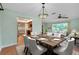 Formal dining room that showcases an adjacent kitchen, living room, and entry at 18375 Lamont Ave, Port Charlotte, FL 33948