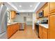 Well-lit kitchen with stainless steel appliances, modern cabinets, and tile backsplash at 18375 Lamont Ave, Port Charlotte, FL 33948