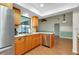 Bright kitchen features wood cabinets, stainless steel appliances, and marble countertops at 18375 Lamont Ave, Port Charlotte, FL 33948