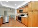 Bright kitchen featuring stainless steel appliances and wooden cabinetry at 18375 Lamont Ave, Port Charlotte, FL 33948