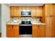 Kitchen showcasing stainless steel oven and microwave plus ample wood cabinets at 18375 Lamont Ave, Port Charlotte, FL 33948