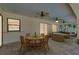 The outdoor living space features a dining table with seating and views of the backyard at 18375 Lamont Ave, Port Charlotte, FL 33948