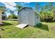 A charming outdoor storage shed nestled in a lush green yard at 18375 Lamont Ave, Port Charlotte, FL 33948