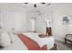 Cozy bedroom with plush carpeting, a comfortable bed, and views to the adjacent bathroom at 186 Portofino Dr, Nokomis, FL 34275
