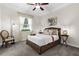 Comfortable bedroom with plush carpeting, a cozy bed, and side tables with lamps at 186 Portofino Dr, Nokomis, FL 34275