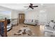 Bright bonus room with tile flooring, ceiling fan, neutral colors, and comfortable seating, ideal for relaxing at 186 Portofino Dr, Nokomis, FL 34275