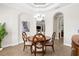 Formal dining room features an arched ceiling and an accent painting at 186 Portofino Dr, Nokomis, FL 34275