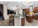 The kitchen island features barstool seating and pendant lights, complemented by stainless steel appliances at 186 Portofino Dr, Nokomis, FL 34275