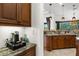 Granite countertops and custom cabinets offering ample space with a view of the backyard at 186 Portofino Dr, Nokomis, FL 34275