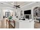 Elegant living room with fireplace, large sectional sofa, decorative wall art and tile floors at 186 Portofino Dr, Nokomis, FL 34275