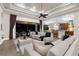 An open-concept living room flows seamlessly into a well-appointed kitchen and screened lanai at 186 Portofino Dr, Nokomis, FL 34275