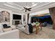Inviting living room with modern decor, fireplace, and seamless access to the outdoor screened in lanai at 186 Portofino Dr, Nokomis, FL 34275