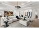 Spacious living room with multiple seating areas, open floor plan, and seamless transition to the kitchen at 186 Portofino Dr, Nokomis, FL 34275