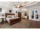 The main bedroom includes a sitting area and backyard access with a view of the pool at 186 Portofino Dr, Nokomis, FL 34275