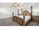 Main bedroom showcases a leafy ceiling fan, neutral carpeting, and double door closet at 186 Portofino Dr, Nokomis, FL 34275