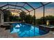Relaxing screened pool and spa with calming reflections and outdoor greenery at 186 Portofino Dr, Nokomis, FL 34275