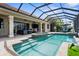 Screened-in pool and spa area with beautiful patio, ideal for outdoor entertaining and relaxation at 186 Portofino Dr, Nokomis, FL 34275