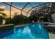 Serene screened pool and spa at sunset, providing a tranquil and luxurious outdoor experience at 186 Portofino Dr, Nokomis, FL 34275