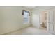 Bedroom featuring a window with curtain valance and an ensuite bathroom at 201 Vestavia Dr, Venice, FL 34292
