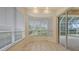 Bright breakfast nook with large windows, tile floor, and access to outdoor pool area at 201 Vestavia Dr, Venice, FL 34292